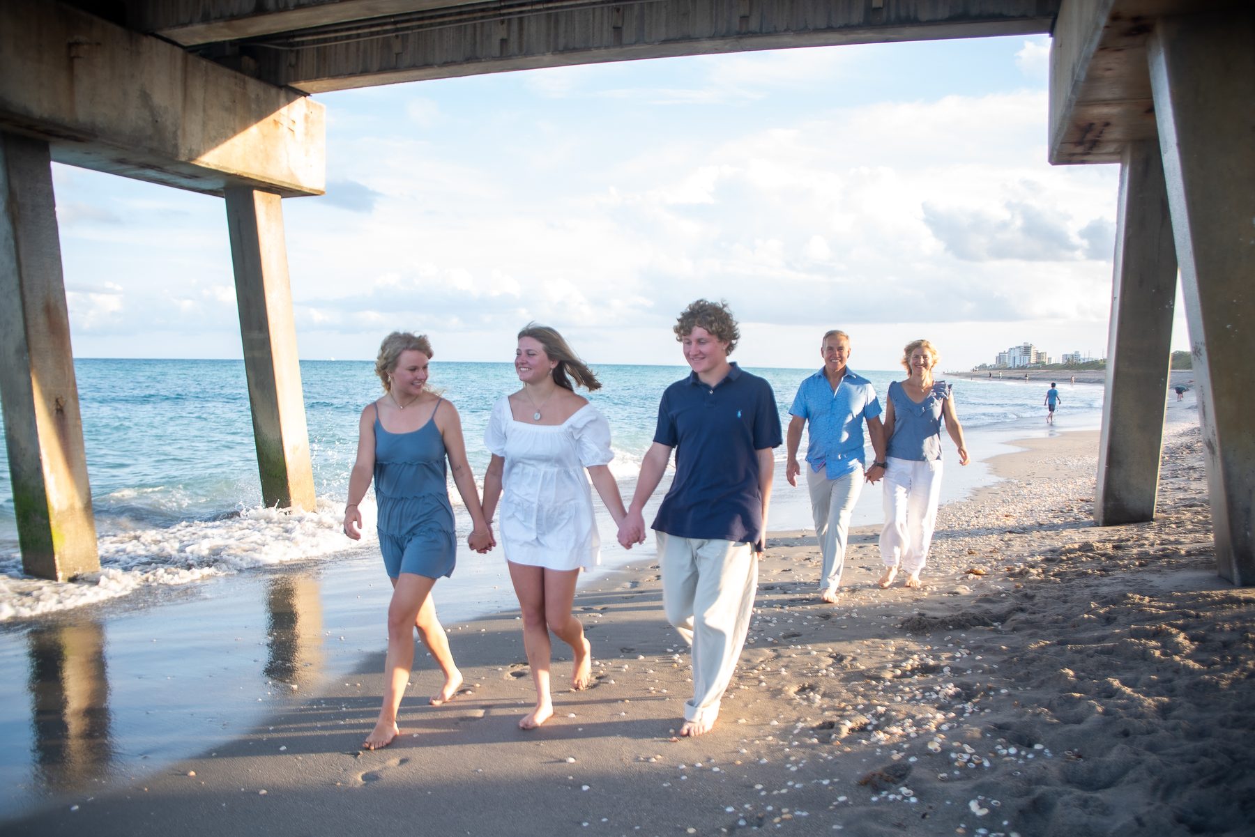 Family walking on the beach at sunset — West Palm Beach lifestyle photography by Concha Solutions
