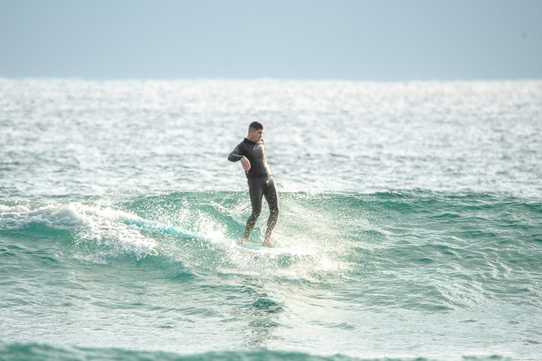Surfer riding a wave — West Palm Beach action photography by Concha Solutions