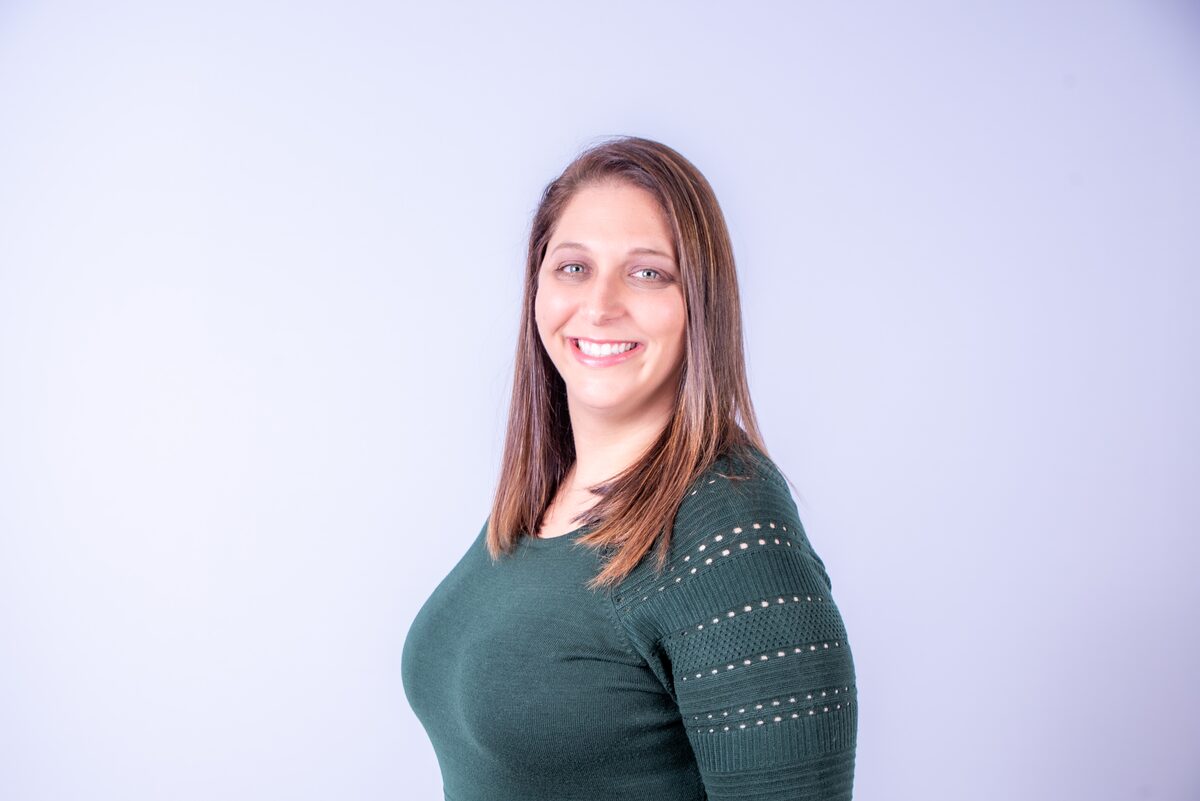 Warm professional headshot, three-quarter profile — West Palm Beach headshot photography by Concha Solutions