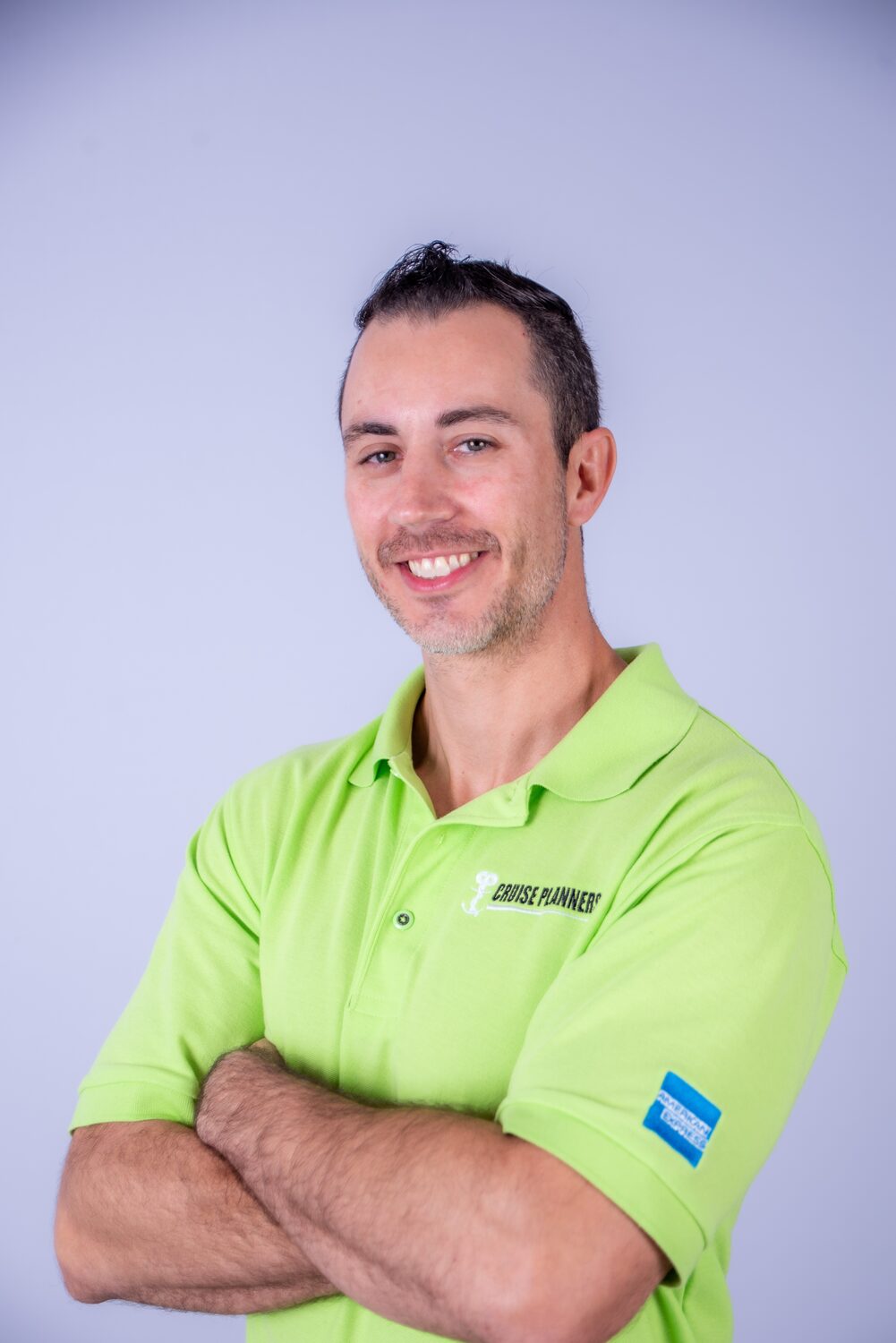 Confident headshot in branded polo, arms crossed — West Palm Beach headshot photography by Concha Solutions