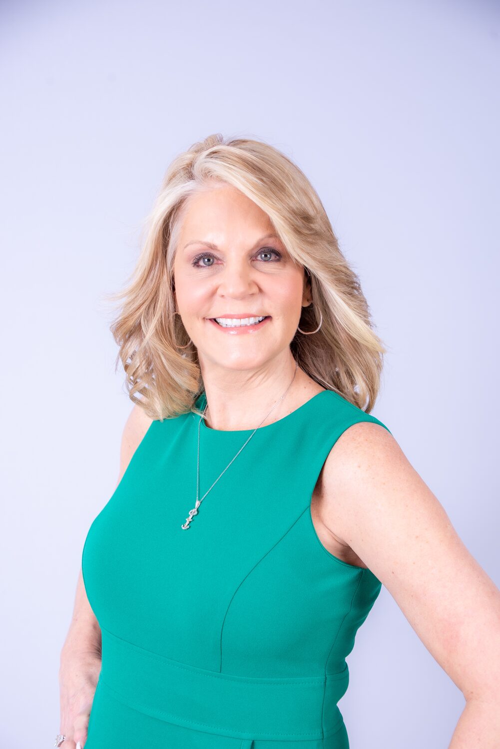 Professional headshot, teal blouse — West Palm Beach headshot photography by Concha Solutions
