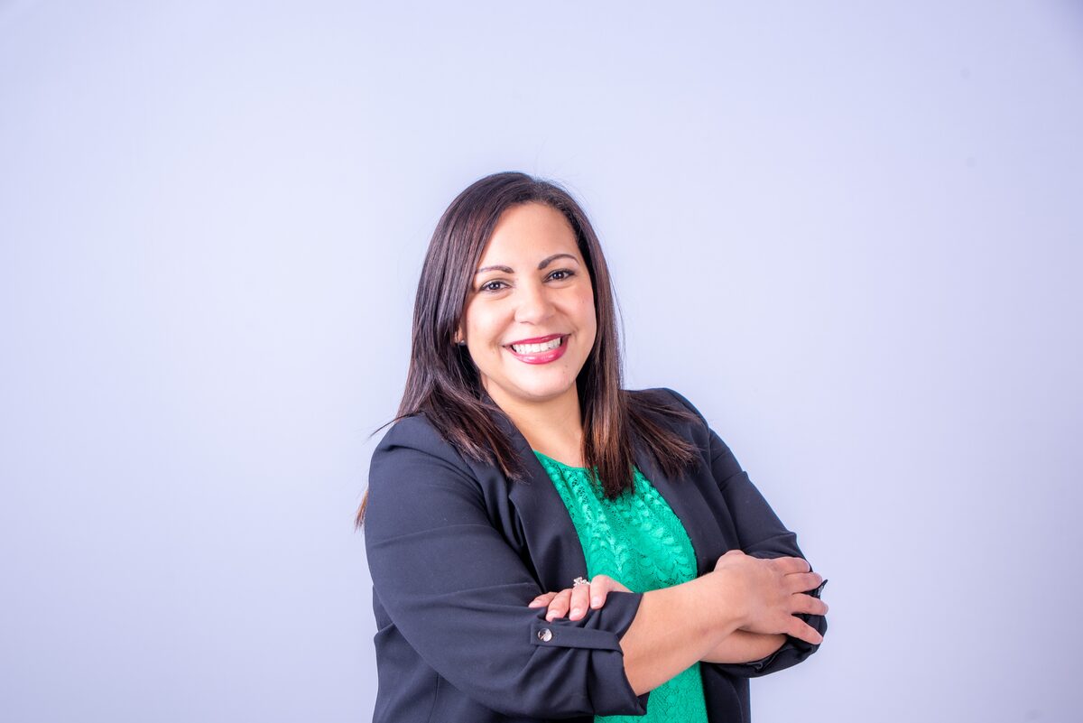Professional headshot, emerald dress — West Palm Beach headshot photography by Concha Solutions